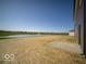 A grassy backyard with a scenic view of the lake at 126 Velvet Hat Rd, Danville, IN 46122
