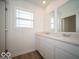 Bathroom featuring a double vanity with marble countertops, dual sinks, and modern fixtures at 126 Velvet Hat Rd, Danville, IN 46122