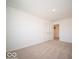 Neutral carpet in bedroom with double doors, offering a versatile and comfortable living space at 126 Velvet Hat Rd, Danville, IN 46122