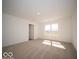 Bright bedroom with neutral carpet, large window, and a doorway, creating a welcoming space at 126 Velvet Hat Rd, Danville, IN 46122