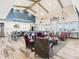 Common area with a large gathering space, high ceilings, exposed beams, and a kitchen area at 126 Velvet Hat Rd, Danville, IN 46122