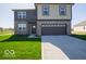 Two-story home with a two-car garage, brick and siding exterior, and a well-manicured front lawn at 126 Velvet Hat Rd, Danville, IN 46122