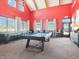 Bright game room featuring a pool table, shuffleboard table, and seating with plenty of natural light at 126 Velvet Hat Rd, Danville, IN 46122