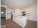 New kitchen with stainless appliances, white cabinets, and large center island at 126 Velvet Hat Rd, Danville, IN 46122