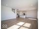 Open-concept living space features wood-look floors, stainless appliances, and ample space for entertaining at 126 Velvet Hat Rd, Danville, IN 46122