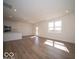 Open-concept living space with wood-look floors, a modern kitchen, recessed lighting, and natural light at 126 Velvet Hat Rd, Danville, IN 46122