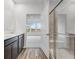 Bathroom with double sink vanity and a glass-enclosed shower at 243 Hunters Ridge Dr, Danville, IN 46122