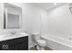 Modern bathroom features sleek vanity, toilet, and tub with shower head at 243 Hunters Ridge Dr, Danville, IN 46122