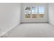 Well-lit bedroom with neutral carpeting and large windows offering a view at 243 Hunters Ridge Dr, Danville, IN 46122