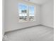 Bright bedroom with neutral carpet, windows, and ample natural light at 243 Hunters Ridge Dr, Danville, IN 46122