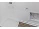 Convenient laundry room featuring wood-look floors and utility connections at 243 Hunters Ridge Dr, Danville, IN 46122