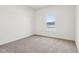 Bright bedroom with neutral carpeting and window view at 7098 Sterling Way, Brownsburg, IN 46112
