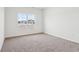 Bright bedroom with neutral carpeting and large window at 7098 Sterling Way, Brownsburg, IN 46112