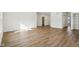 Bright and airy living area with hardwood floors and access to other rooms at 7098 Sterling Way, Brownsburg, IN 46112