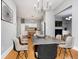 Spacious dining room featuring modern lighting and a unique concrete dining table at 1423 Hoyt Ave, Indianapolis, IN 46203