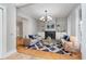 Bright living room with a fireplace, built-in shelves, and a stylish blue rug at 1423 Hoyt Ave, Indianapolis, IN 46203