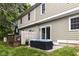 Charming patio area with sliding glass doors accessing the backyard and lush greenery, perfect for outdoor relaxation at 383 Carmelaire Ct, Carmel, IN 46032