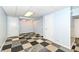 Finished basement room with checkered flooring and neutral walls at 383 Carmelaire Ct, Carmel, IN 46032