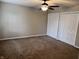 Empty bedroom with fan and double closet at 383 Carmelaire Ct, Carmel, IN 46032