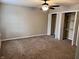 Empty bedroom with fan and closet with shelving at 383 Carmelaire Ct, Carmel, IN 46032