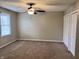 Bedroom with window, fan, and double closet at 383 Carmelaire Ct, Carmel, IN 46032