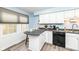 Updated kitchen with breakfast bar and sleek countertops at 383 Carmelaire Ct, Carmel, IN 46032