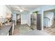 Modern kitchen with stainless steel refrigerator and hardwood floors at 383 Carmelaire Ct, Carmel, IN 46032