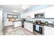 Bright eat-in kitchen with stainless steel appliances and light-colored cabinetry at 383 Carmelaire Ct, Carmel, IN 46032