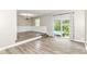 Spacious living room with sliding glass doors and modern hardwood floors, seamlessly blending indoor and outdoor living at 383 Carmelaire Ct, Carmel, IN 46032
