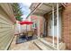 Inviting patio with table, chairs, and umbrella, perfect for outdoor dining at 383 Carmelaire Ct, Carmel, IN 46032