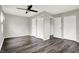 Spacious bedroom with multiple closets and dark wood-look floors at 8902 Carla Dr, Indianapolis, IN 46219