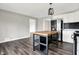 A well lit open kitchen area with a butcher block island and stainless steel appliances at 8902 Carla Dr, Indianapolis, IN 46219