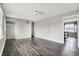 A large, open living room area with dark wood-look floors and neutral paint at 8902 Carla Dr, Indianapolis, IN 46219