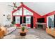 Bright living room featuring vaulted ceilings, fireplace, and large windows for plenty of natural light at 11736 Grazing Ln, Indianapolis, IN 46239