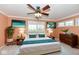Comfortable main bedroom showcasing a large bed, a ceiling fan, and neutral tones at 11736 Grazing Ln, Indianapolis, IN 46239