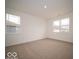 Spacious bedroom with large windows and neutral carpet offers ample natural light at 6322 Granby Dr, Whitestown, IN 46075