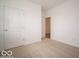 Neutral carpeted bedroom featuring white walls, two doors and offering a versatile space for personalization at 6322 Granby Dr, Whitestown, IN 46075