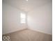 Bright, carpeted bedroom with a large window providing natural light at 6322 Granby Dr, Whitestown, IN 46075