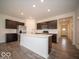 Modern eat-in kitchen with stainless appliances, sleek cabinets, and center island at 6322 Granby Dr, Whitestown, IN 46075