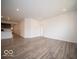 Bright living room boasts modern vinyl floors, recessed lights, and flows into the open-concept kitchen at 6322 Granby Dr, Whitestown, IN 46075