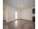 Bright open living room with hard surface flooring, white walls and door to backyard at 6322 Granby Dr, Whitestown, IN 46075