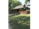 Charming home boasts a full wrap-around porch, stone chimney and is surrounded by mature trees at 1155 Cope Rd, Martinsville, IN 46151