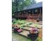 Inviting home featuring a full wrap-around porch, manicured flower beds and mature trees at 1155 Cope Rd, Martinsville, IN 46151