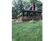 Attractive home featuring full wrap-around porch, American flag and mature trees at 1155 Cope Rd, Martinsville, IN 46151