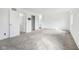 Bright bedroom with plush carpet, closet space, and a connected bathroom at 5527 Vin Rose Ln, Lawrence, IN 46226