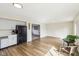 Bright eat in kitchen with light cabinets, black appliances and hardwood flooring at 5527 Vin Rose Ln, Lawrence, IN 46226