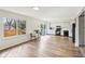 Modern kitchen with white cabinets, black appliances, and hardwood floors at 5527 Vin Rose Ln, Lawrence, IN 46226