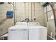Functional laundry room with washer and dryer and essential utilities for convenience at 5527 Vin Rose Ln, Lawrence, IN 46226
