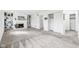 Spacious living room featuring a fireplace, built in shelving, and neutral carpeting at 5527 Vin Rose Ln, Lawrence, IN 46226