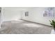 Inviting living room with natural light, neutral carpet, and views of the outdoors at 5527 Vin Rose Ln, Lawrence, IN 46226